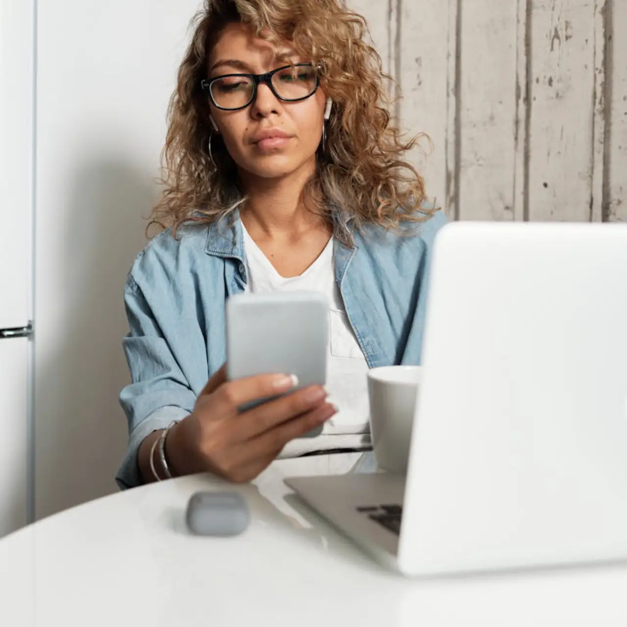 A woman checking the news on here phone